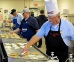 Kiwanis Club of Peachtree City's pancake chefs flip hotcakes at last year's event. Photo/Special.